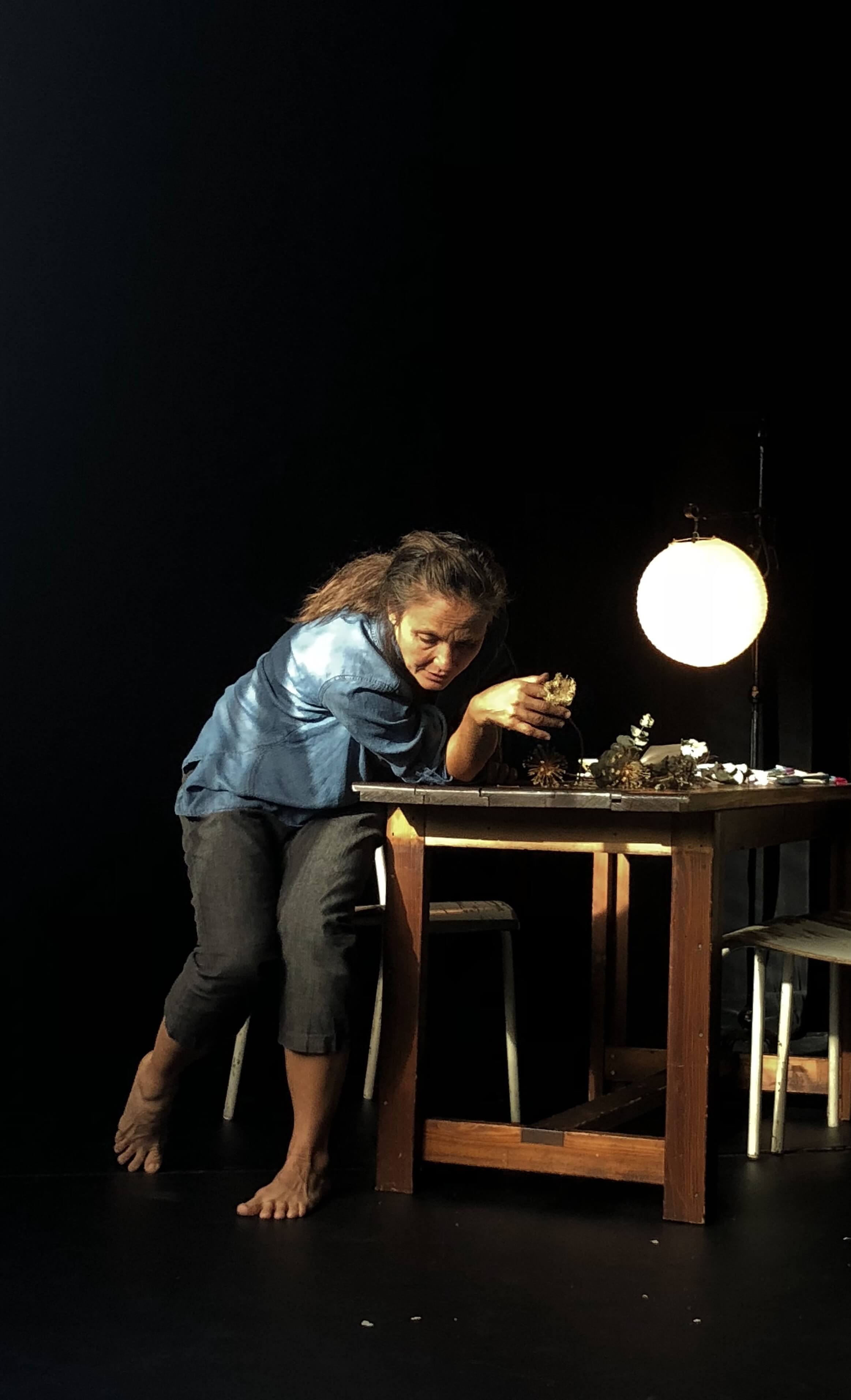 leaning on table with moon lamp