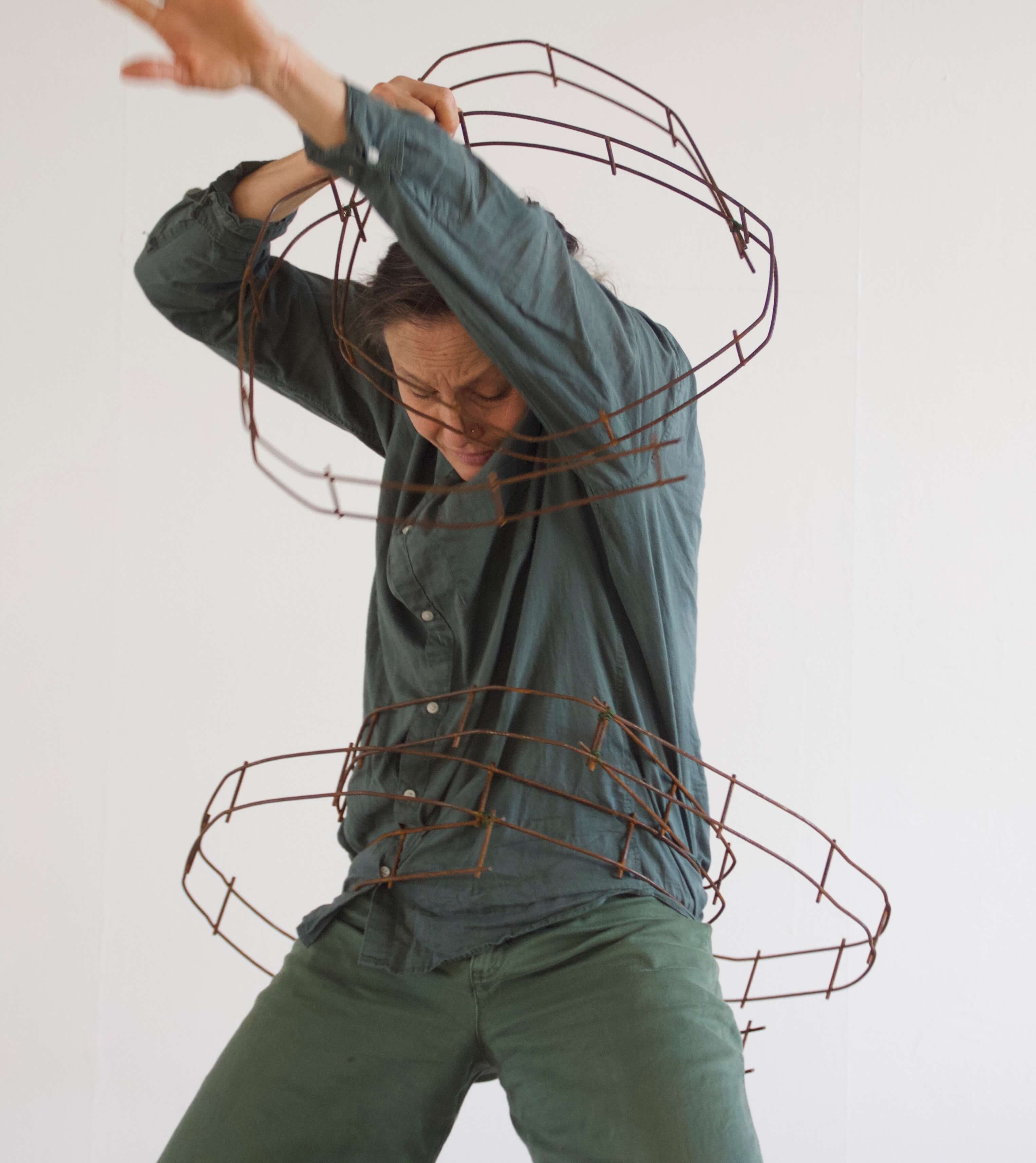 metal tracks wrapped around waist and shoulders